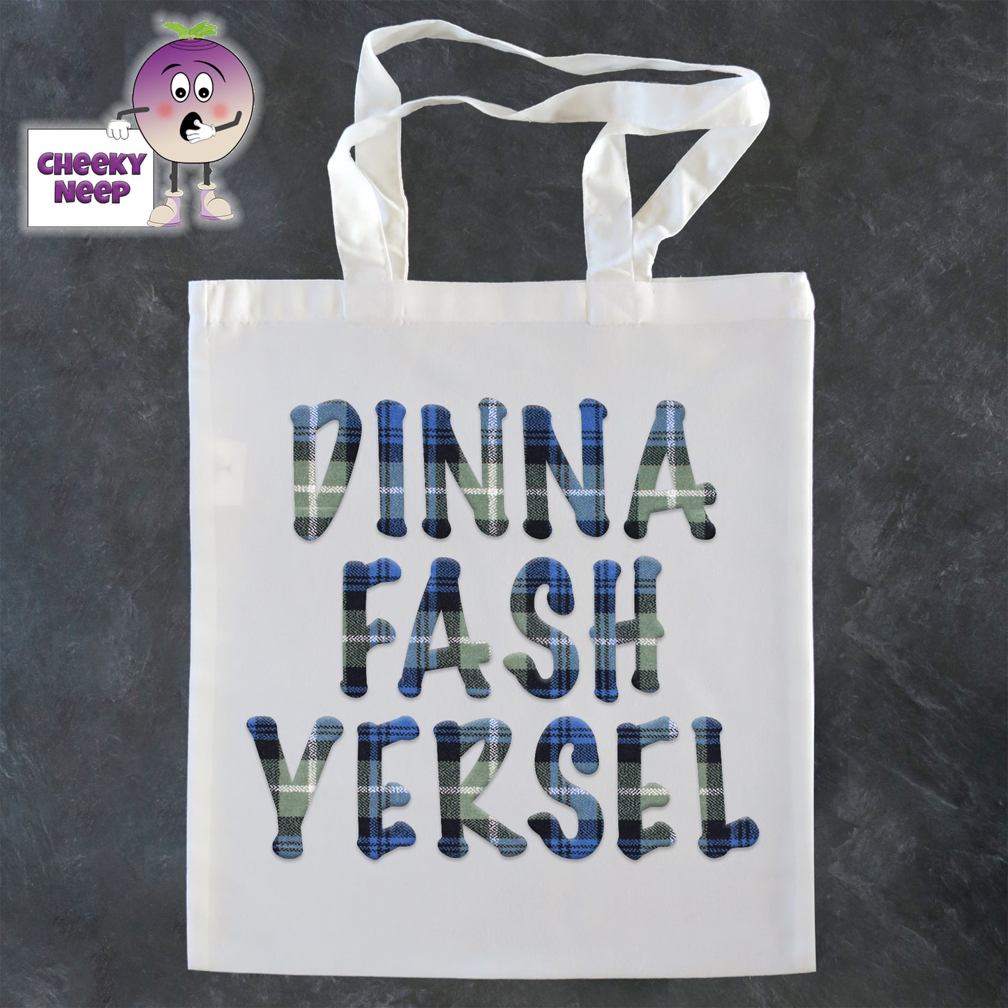 Tote Shopping bag in white with the words "Dinna Fash Yersel" printed on the bag