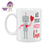 White ceramic mug with the picture of a gray robot with a large red heart in its left hand and the words 