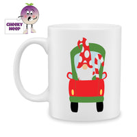 White ceramic mug with a picture of a green and red truck being driven by a gnome in a red and white spotted hat. Mug as produced by Cheekyneep.com