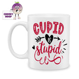 white ceramic mug with the words "Cupid is Stupid" printed on the mug. Mug as produced by Cheekyneep.com