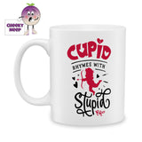 white ceramic mug with the words "Cupid rhymes with Stupid" printed on the mug. Mug as produced by Cheekyneep.com