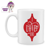 white ceramic mug with a red arabesque and the words I love you printed on the mug as produced by Cheekyneep.com