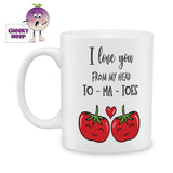 white ceramic mug with a picture of two tomatoes with a red love heart above them. Also above them is the words "I love you from my head to-ma-toes". Mug is produced by Cheekyneep.com