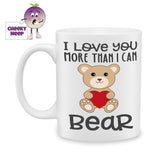 white ceramic mug with the words "I love you more than I can bear" printed above and below a picture of a cuddly bear holding a red love heart. Mug as produced by Cheekyneep.com