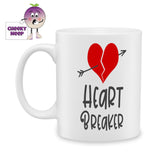 white ceramic mug with a picture of a red heart torn in two with a arrow going through it and the words "Heart Breaker" below printed on the mug. Mug as produced by Cheekyneep.com