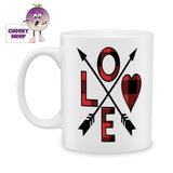 white ceramic mug with two arrows crossed to make four quadrants. The quadrants spell out the word "Love" which is written in a red and black check pattern. Mug as produced by Cheekyneep.com