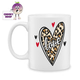 white ceramic mug with a picture of a love heart in leopard print on the mug. In the middle is the word "Love"Mug as produced by Cheekyneep.com