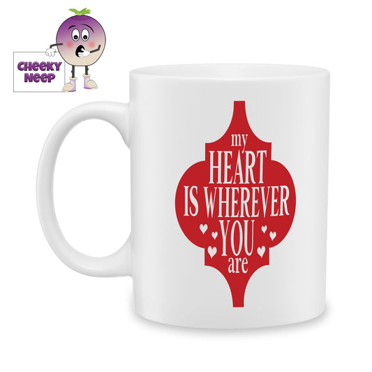 white ceramic mug with a red arabesque shape and the words "My heart is wherever you are" printed in white over the shape. Mug as produced by Cheekyneep.com