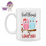 white ceramic mug with two owls sitting on a tree branch. Above and below the owls are the words "Owl Always Love You". Mug as produced by Cheekyneep.com