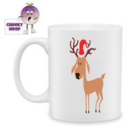 White ceramic mug with a picture of a reindeer wearing a christmas hat printed on the mug. As produced by Cheekyneep.com