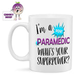 10oz white ceramic gloss mug with the words "I'm a PARAMEDIC what's your superpower" printed twice on the mug. Also showing is a small action bubble in blue with the word "POW"