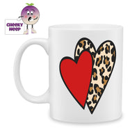 white ceramic mug with a red heart and a leopard skin printed heart printed on the mug. Mug as produced by Cheekyneep.com