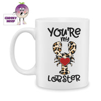 white ceramic mug with a picture of a lobster which is in leopard print and in the middle is a red heart. The words 