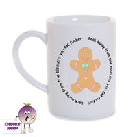 White porcelain mug with a picture of a gingerbread man and the slogan surrounding the picture saying 