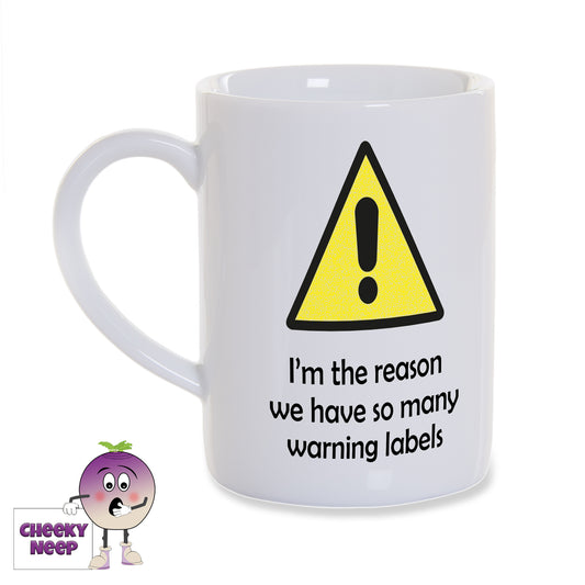 8oz white gloss porcelain mug with a picture of a yellow warning triangle with a black exclamation mark showing in the middle of the triangle. Below in black text is "I'm the reason we have so many warning labels"