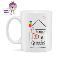 White ceramic mug with the outline of a house with fireworks coming out of the chimney and ballooned holding up coloured bunting. Inside the outline of the house is printed the slogan 