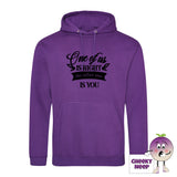 Purple hoodie with the slogan One of us is right and the other one is you printed on the front of the hoodie