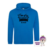 Sapphire blue hoodie with the slogan One of us is right and the other one is you printed on the front of the hoodie