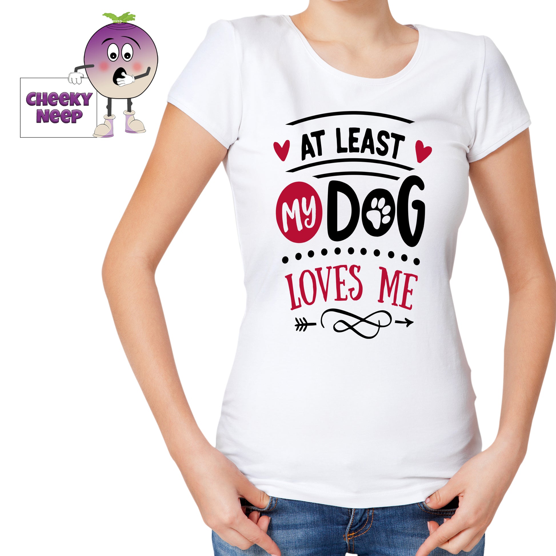 Woman wearing a white tee with the slogan "At least my dog loves me" printed on the tee. Tee as produced by Cheekyneep.com