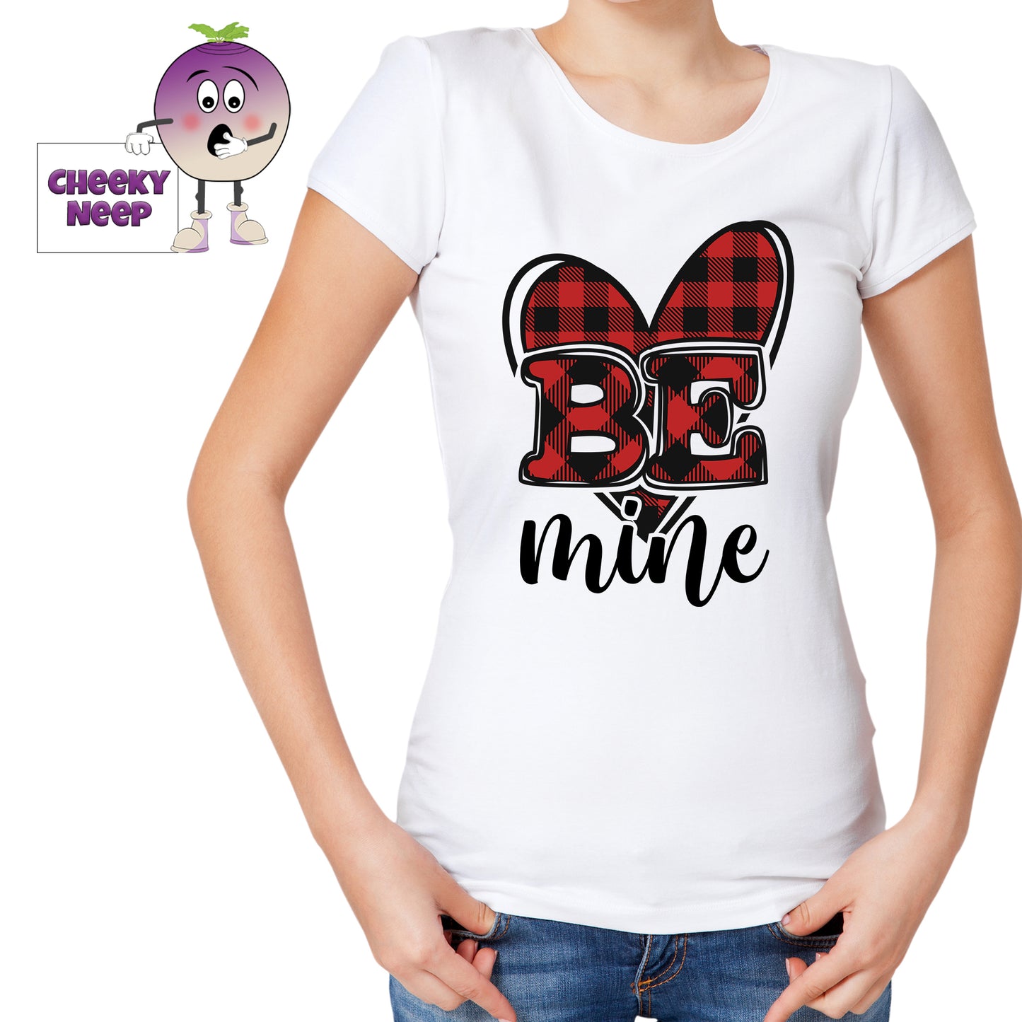 Woman in a white tee with the slogan "Be Mine" printed in front of a red check print heart shape on the tee. Tee as produced by Cheekyneep.com