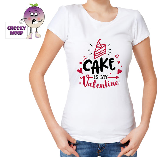 Woman in a white tee with the slogan "Cake is my valentine" printed on the tee in black and red. Tee as produced by Cheekyneep.com