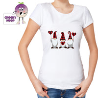 Woman in white t-shirt with a picture of three gnomes holding hearts printed on the teeshirt. Tee as produced by Cheekyneep.com