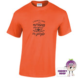 Orange tee with the slogan i dont like morning people or mornings or people printed on the front