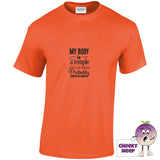 Orange tee with the slogan my body is a temple ancient and crumbling probably cursed or haunted printed on the front