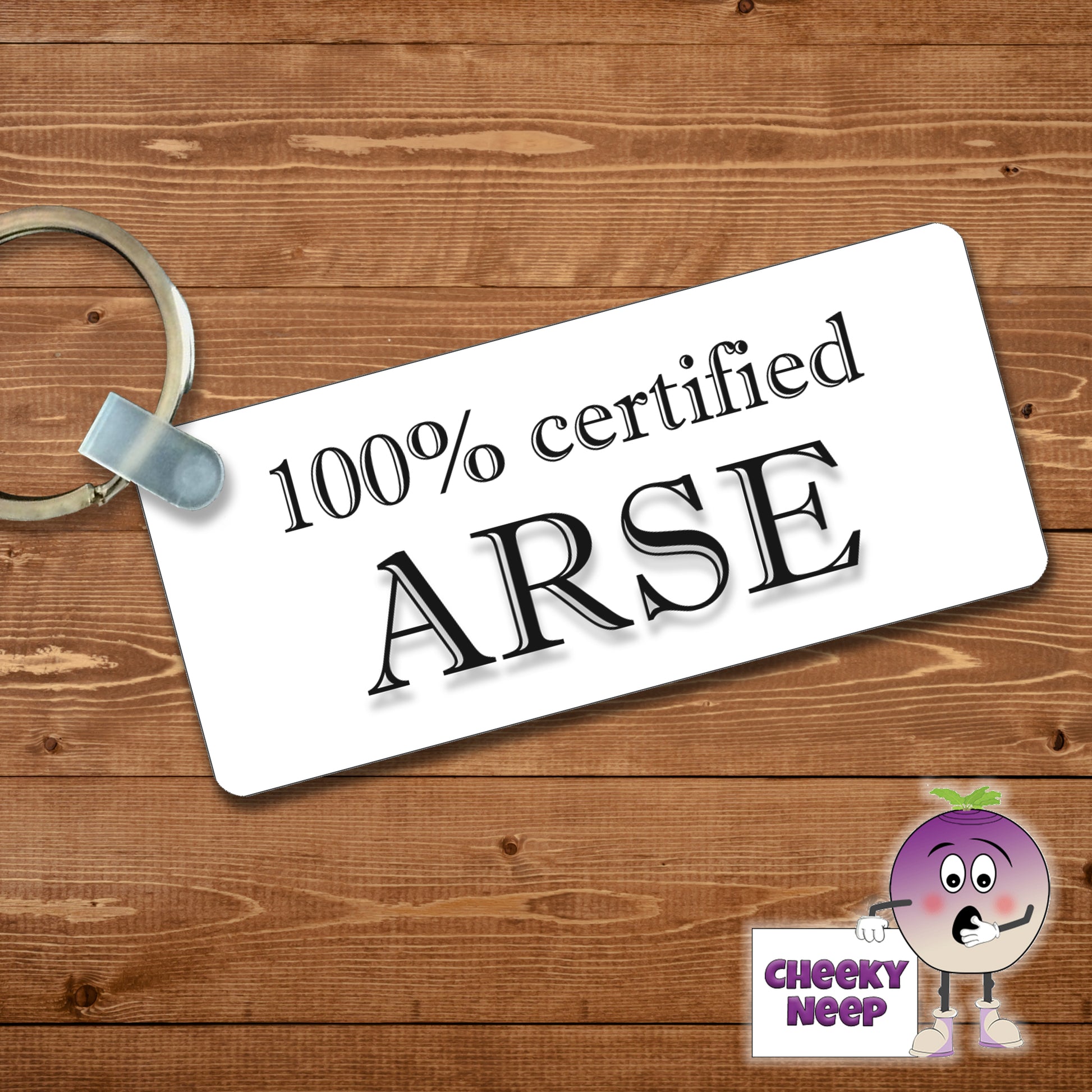 Rectangular plastic keyring with the words "100% certified Arse" printed on both sides.