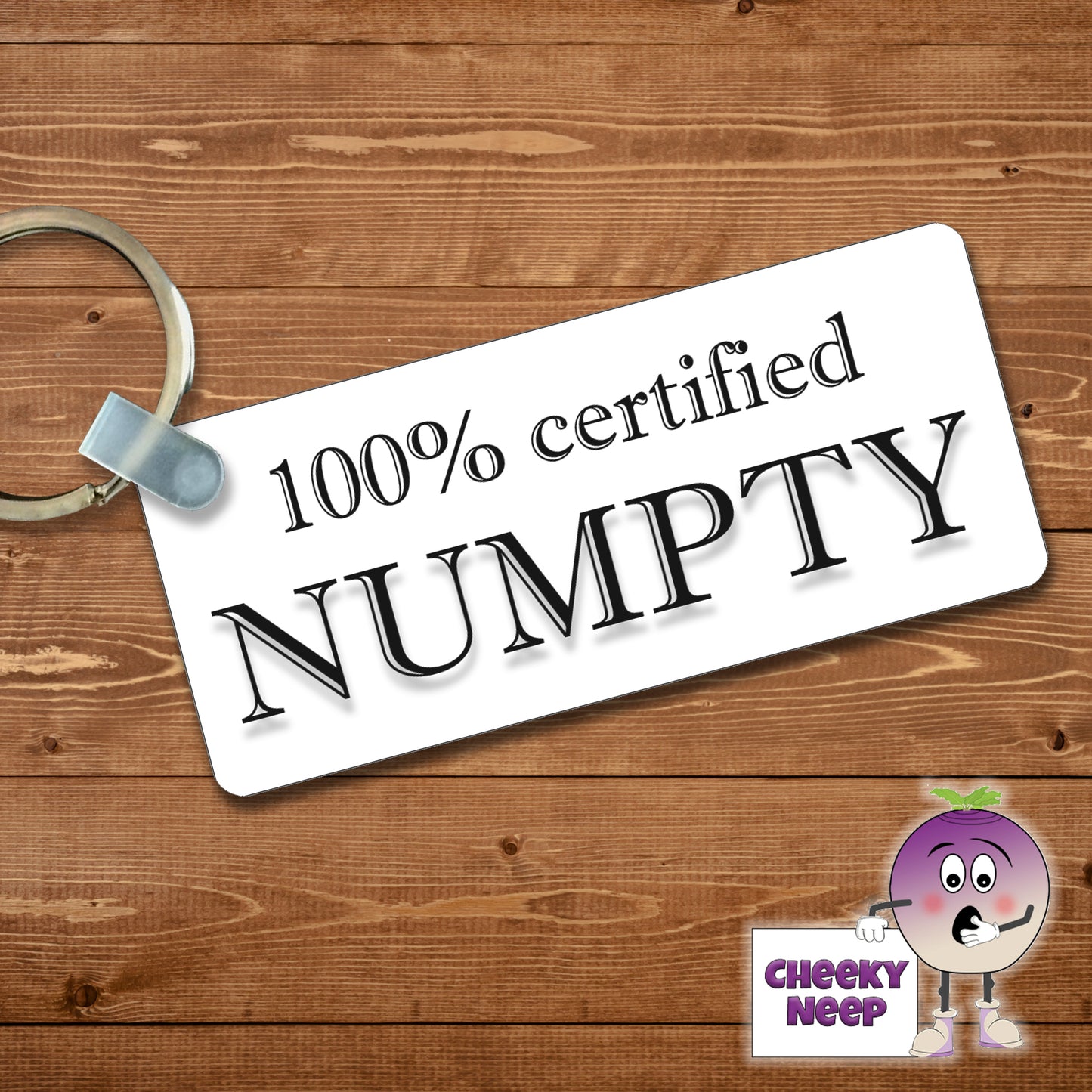 Rectangular plastic keyring with the words "100% certified Numpty" printed on both sides.