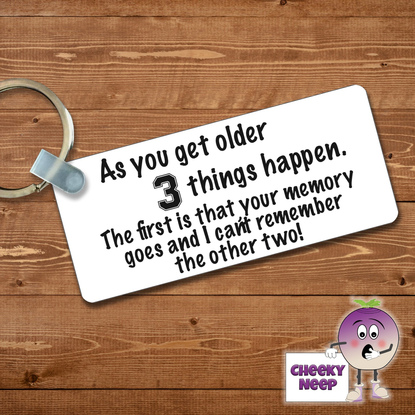 Rectangular plastic keyring with the words "As you get older 3 things happen. The first is that your memory goes and I can't remember the other two!" printed on both sides.