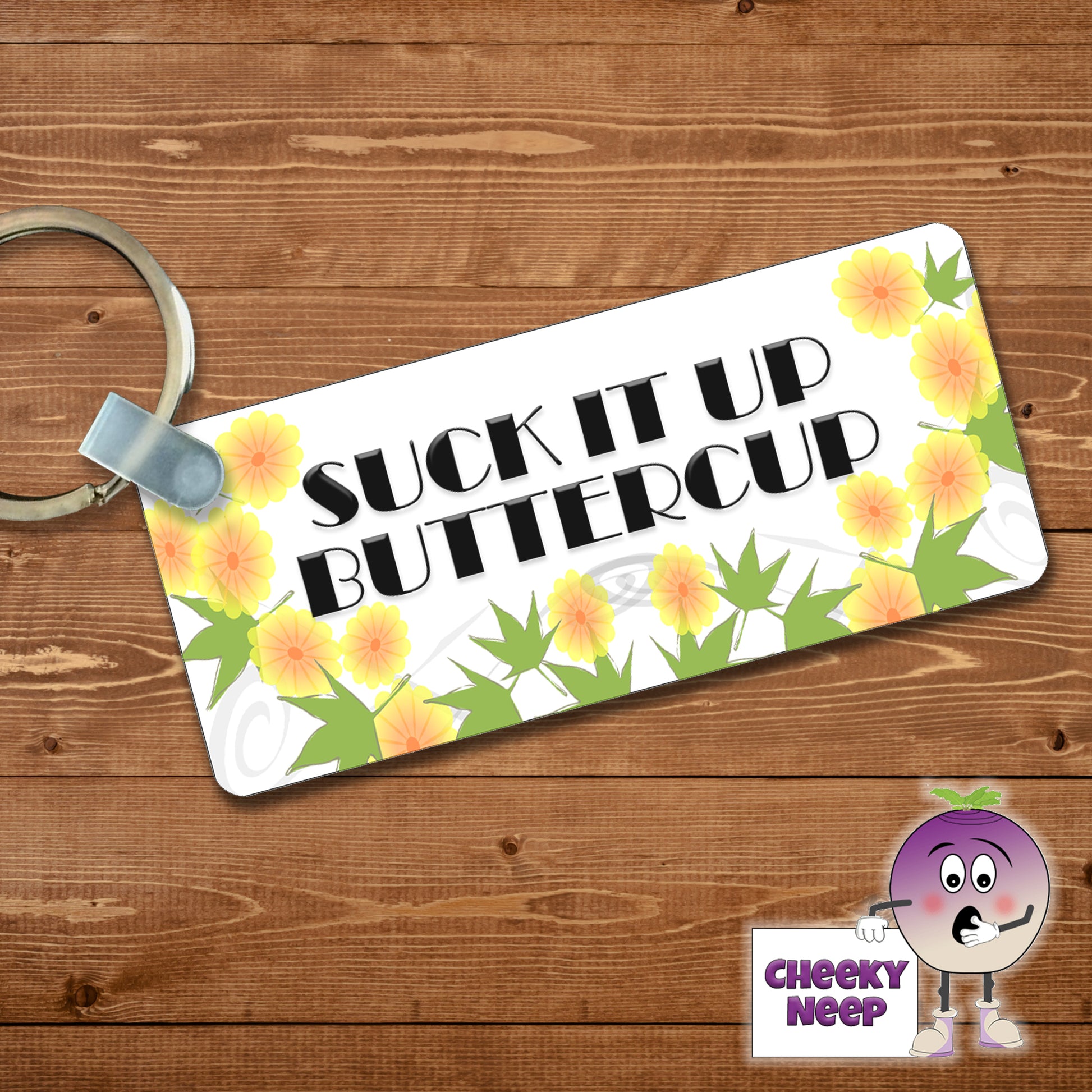 Rectangular plastic keyring with the words "Suck it up buttercup" printed on both sides.