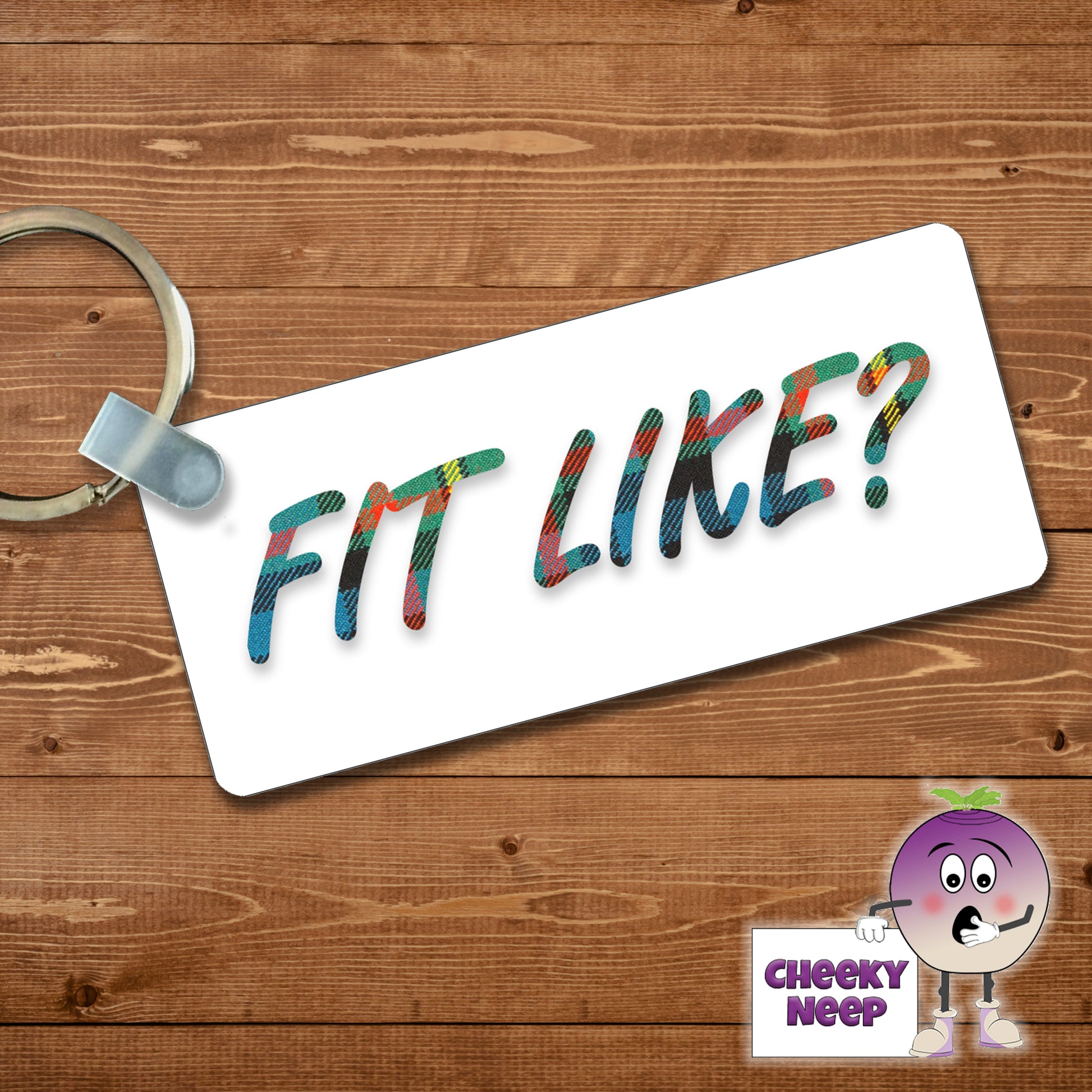 Rectangular plastic keyring with the words "Fit Like?" printed in a tartan font on a white background on both sides.