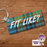 Rectangular plastic keyring with the words "Fit Like?" printed in white on a tartan background on both sides.