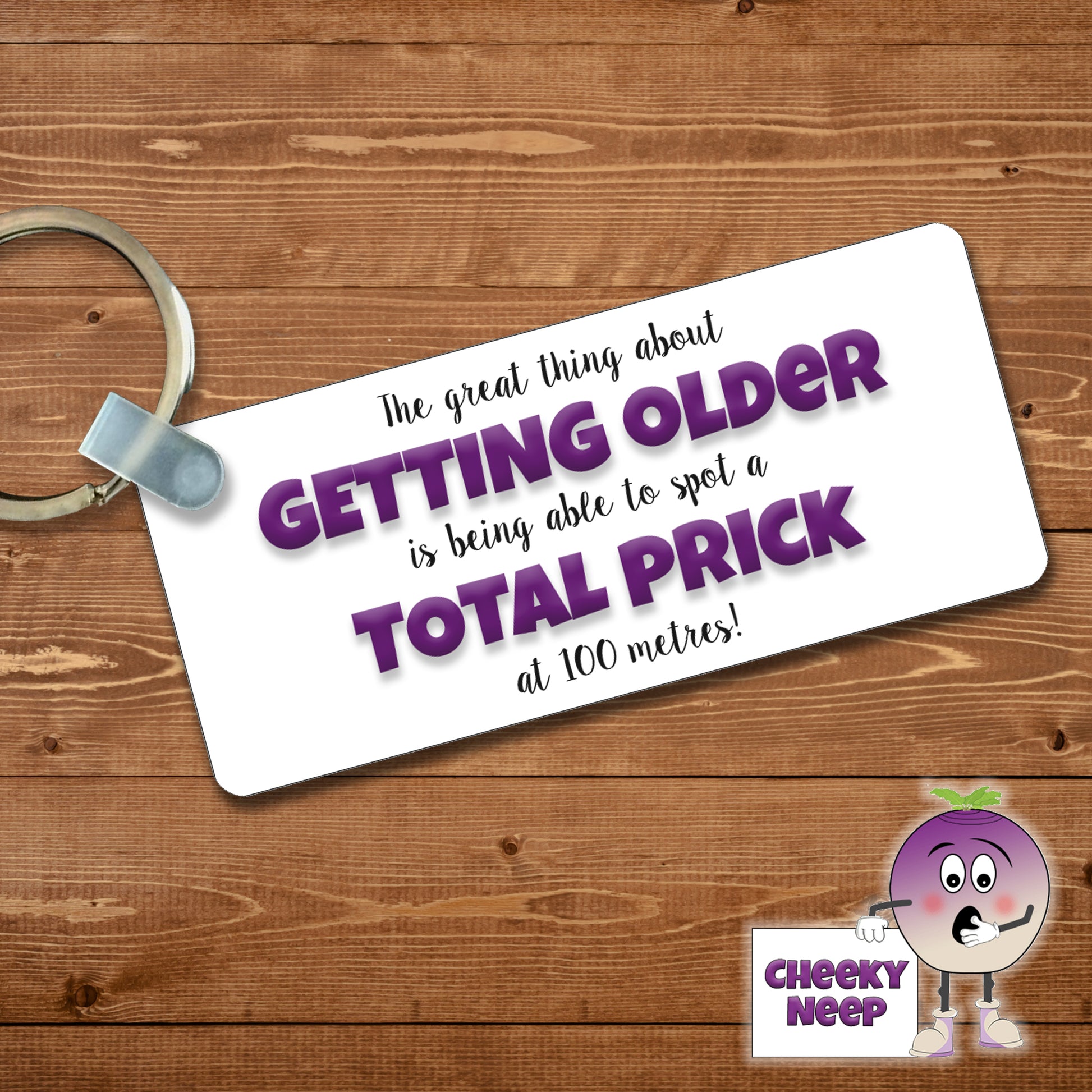 Rectangular plastic keyring with the words "The great thing about GETTING OLDER is being able to spot a TOTAL PRICK at 100 metres!" printed on both sides.