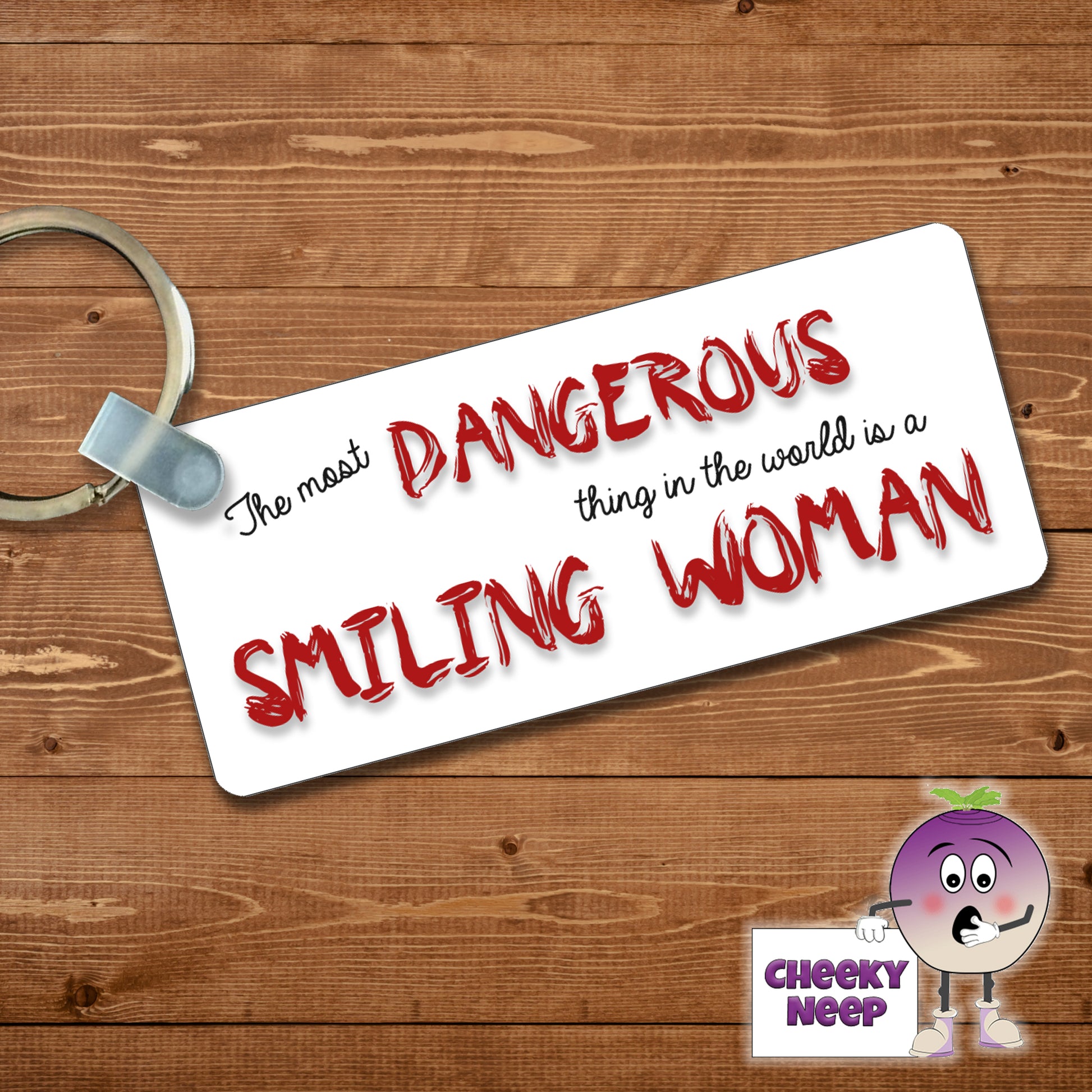 Rectangular plastic keyring with the words "The most DANGEROUS thing in the world is a SMILING WOMAN" printed on both sides.