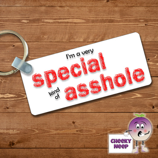 Rectangular plastic keyring with the words "I'm a very SPECIAL kind of ASSHOLE" printed on both sides.