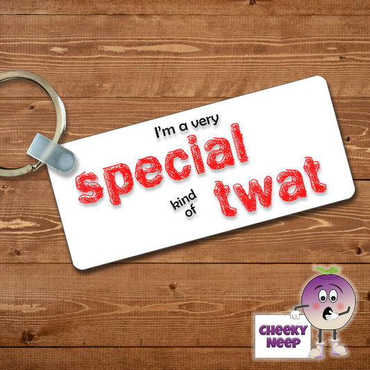 Rectangular plastic keyring with the words "I'm a very special kind of twat" printed on both sides.