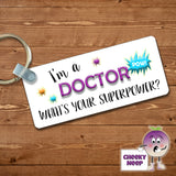 Rectangular plastic keyring with the words "I'm a DOCTOR what's your SUPERPOWER?" printed on both sides.