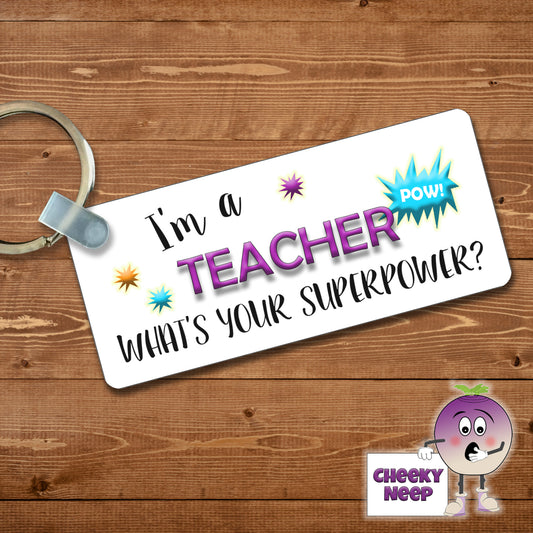 Rectangular plastic keyring with the words "I'm a TEACHER what's your SUPERPOWER?" printed on both sides.