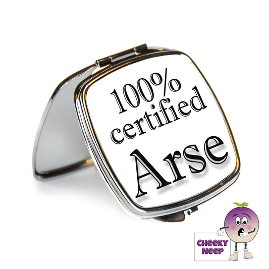 Square steel compact mirror with the words "100% certified Arse" printed on the front of the mirror.