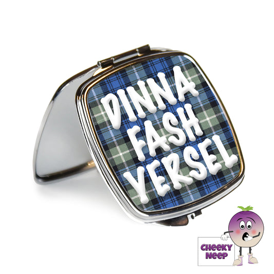 Square steel compact mirror with the words "Dinna Fash Yersel" printed on the front of the mirror.