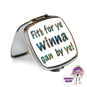 Square steel compact mirror with the words "Fit's For Ye Winna Gan By Ye!" printed on the front of the mirror.