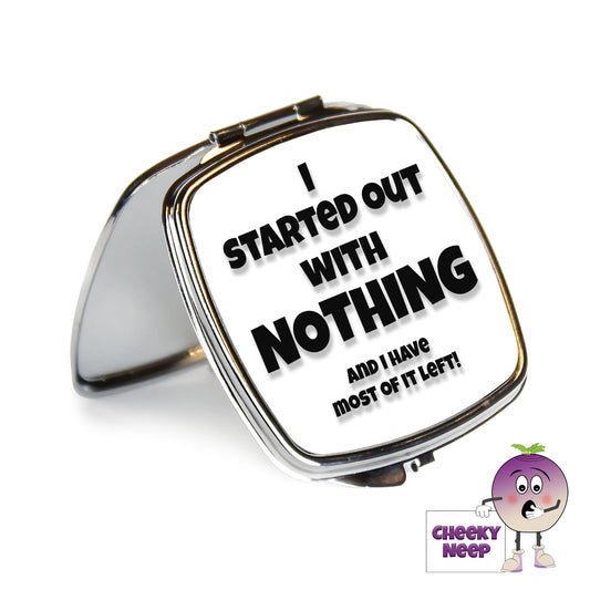 Square steel compact mirror with the words "I started out with nothing and I have most of it left!" printed on the front of the mirror.