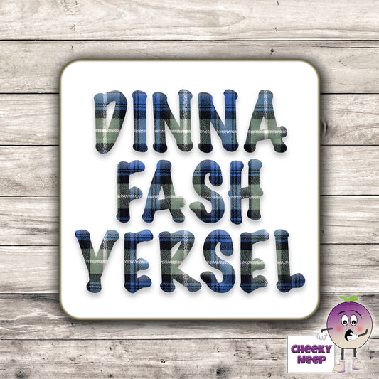 Square hardbacked coaster with the words "Dinna Fash Yersel" printed on it.