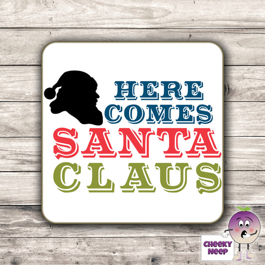 Drinks coaster with the words "Here comes Santa Claus" printed on the coaster as produced by Cheekyneep.com