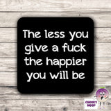 Black coaster with the words "The less you give a fuck the happier you will be" printed on it as supplied by Cheekyneep.com