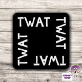 Square black hardboard coaster with the words "Twat" printed four times around the outside of the coaster. As produced by CheekyNeep.com