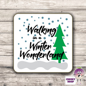 Drinks coaster with the words "Walking in a Winter Wonderland" printed on the coaster as produced by Cheekyneep.com
