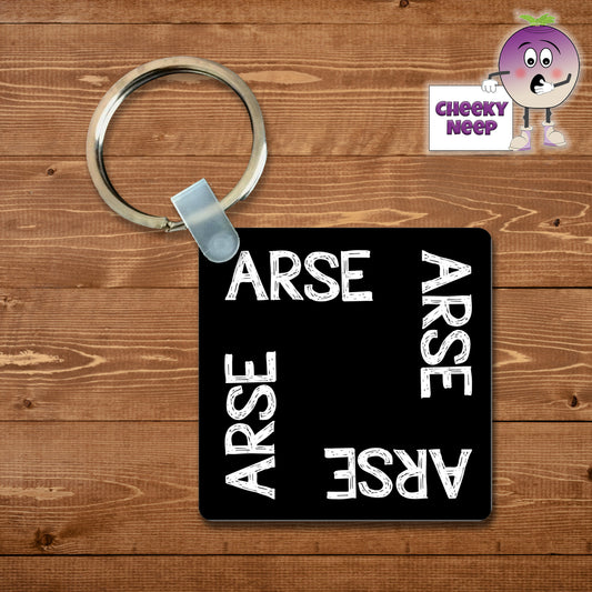 Black square keyring with the word "Arse" printed four times on the keyring as supplied by Cheekyneep.com